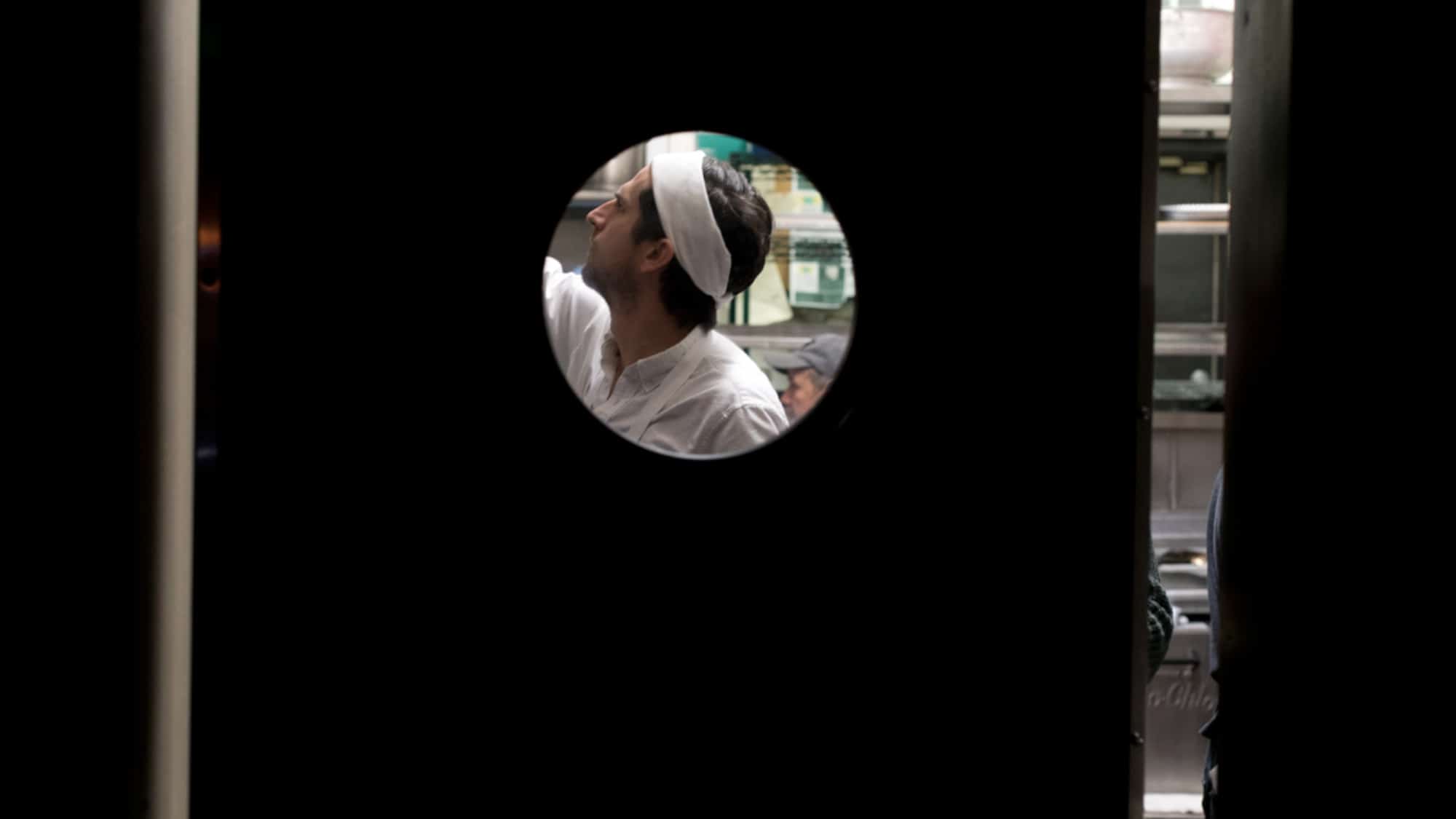 A cook working in the kitchen